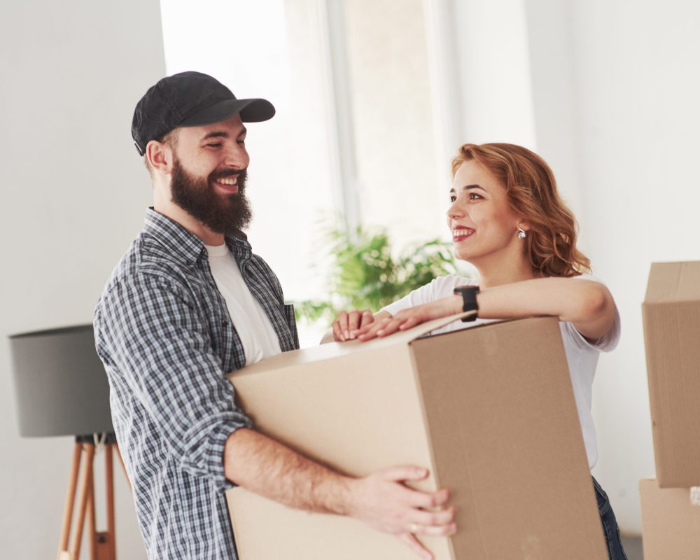 Positive emotions. Happy couple together in their new house. Conception of moving.